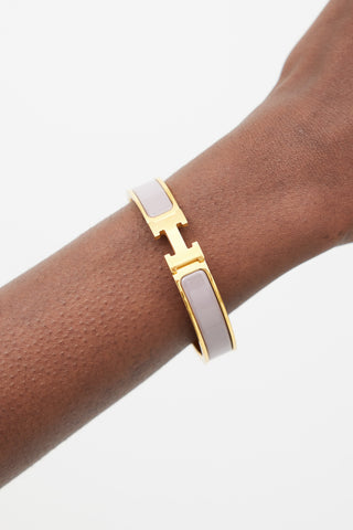 Hermès Purple 
Gold Clic H Bracelet