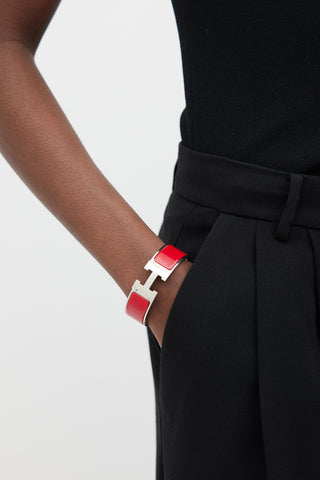 Hermès Red 
Silver Clic Clac H Bracelet