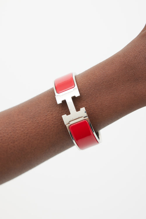 Hermès Red 
Silver Clic Clac H Bracelet