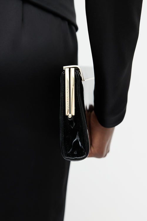 Jimmy Choo Black 
Gold Patent Leather Clutch