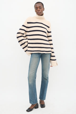 Khaite Cream 
Navy Cashmere Striped Turtleneck