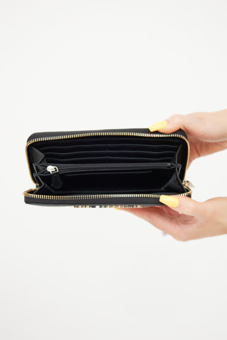 Moschino Black 
Gold Quilted Leather Wallet