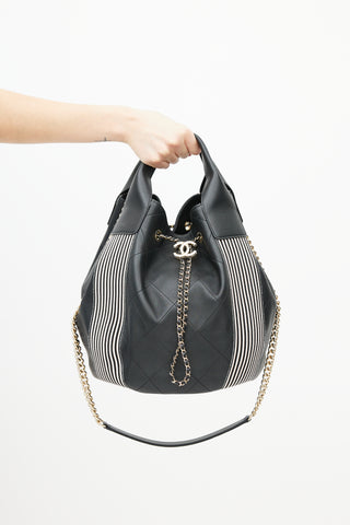 Chanel 2019 Black 
White Stitched Drawstring Leather Bag