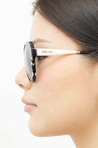 Miu Miu Black 
White SMU 06P Sunglasses