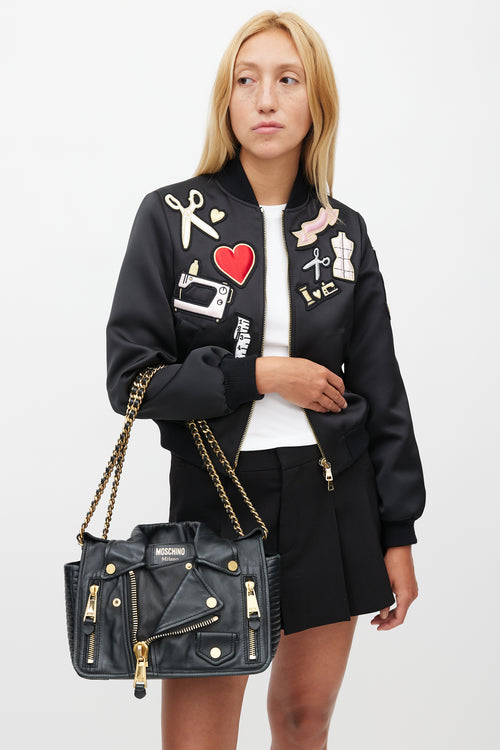 Moschino Black 
Gold Leather Biker Shoulder Bag