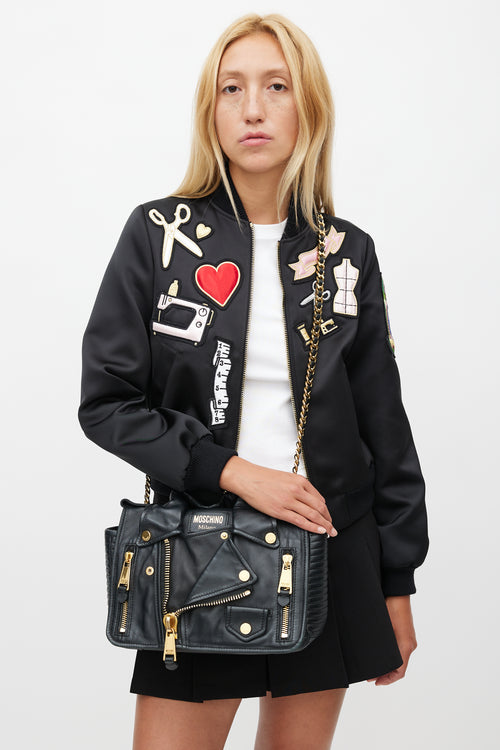 Moschino Black 
Gold Leather Biker Shoulder Bag