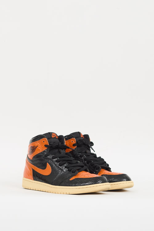 Nike Air Jordan Black 
Orange Retro High 1 Sneaker