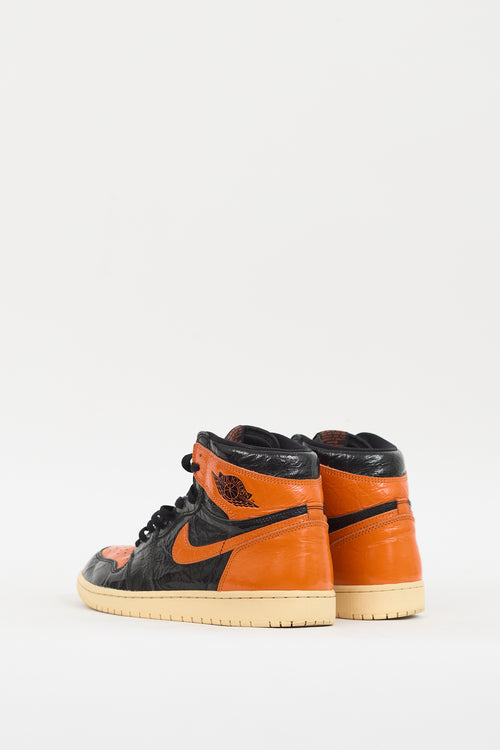 Nike Air Jordan Black 
Orange Retro High 1 Sneaker