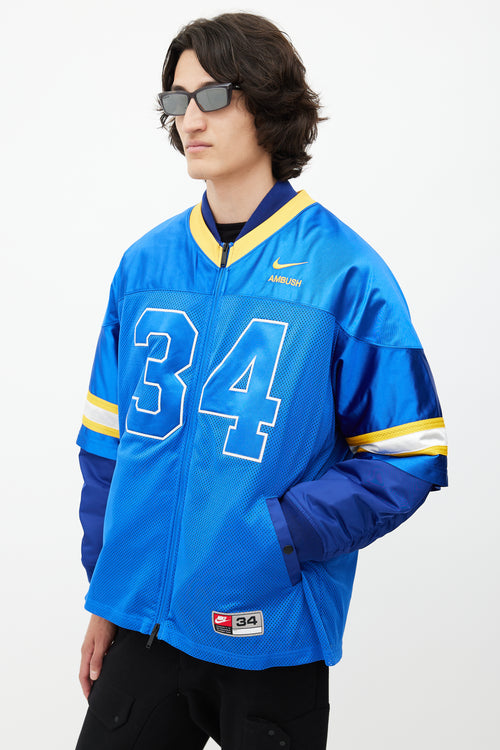 Nike x Ambush Blue 
Yellow Jersey Bomber Jacket