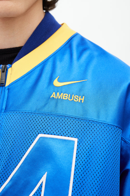 Nike x Ambush Blue 
Yellow Jersey Bomber Jacket