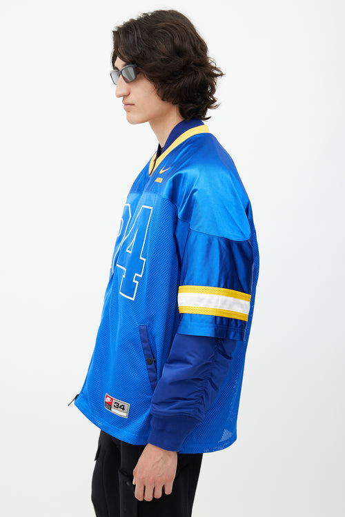 Nike x Ambush Blue 
Yellow Jersey Bomber Jacket