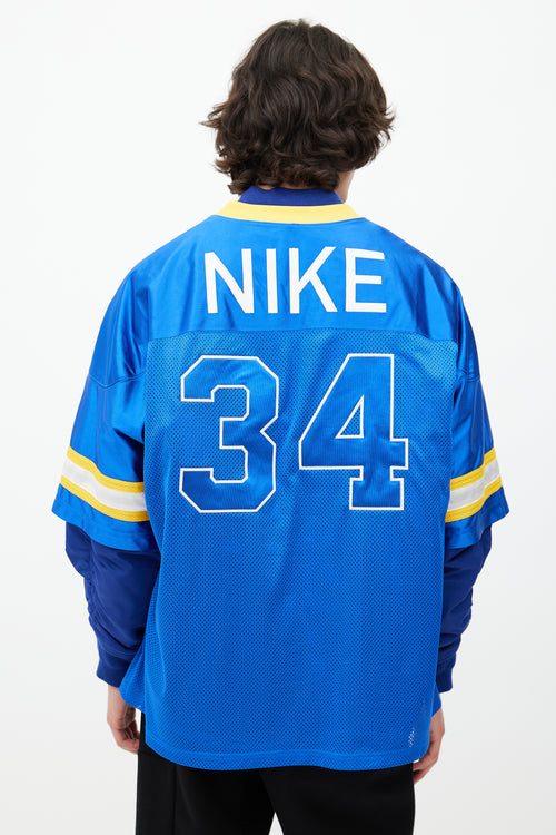 Nike x Ambush Blue 
Yellow Jersey Bomber Jacket