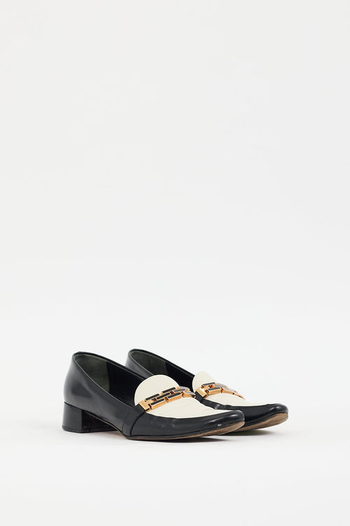 Prada Black 
Cream Leather Buckle Heeled Loafer