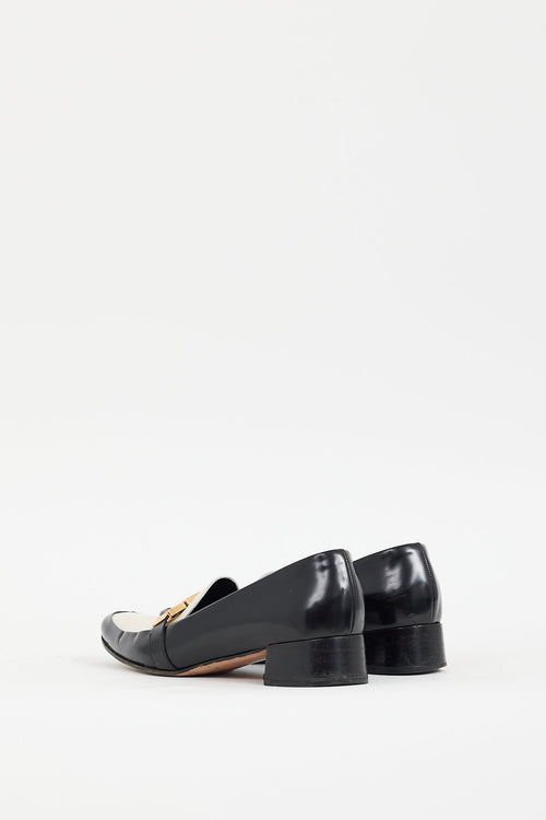 Prada Black 
Cream Leather Buckle Heeled Loafer