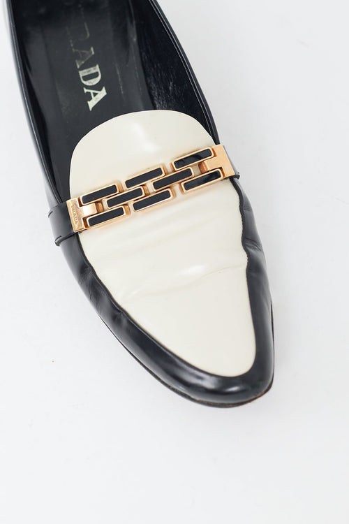 Prada Black 
Cream Leather Buckle Heeled Loafer