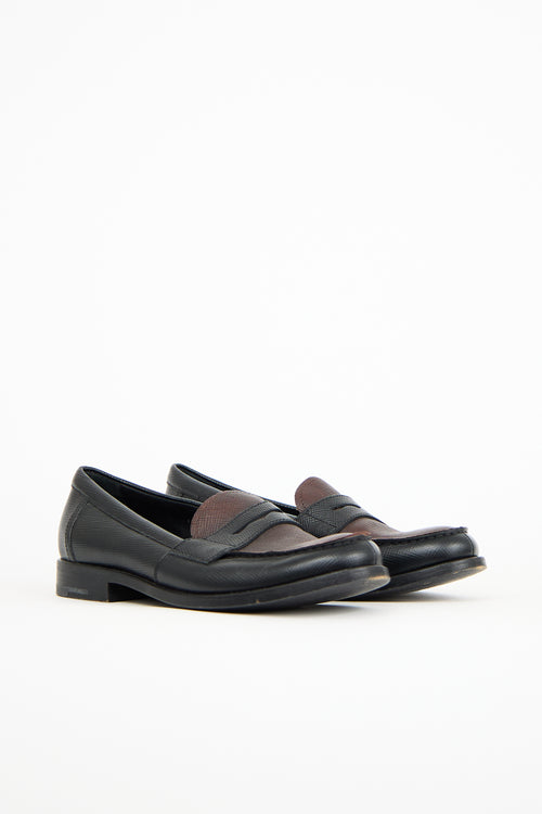 Prada Black 
Brown Textured Leather Penny Loafer