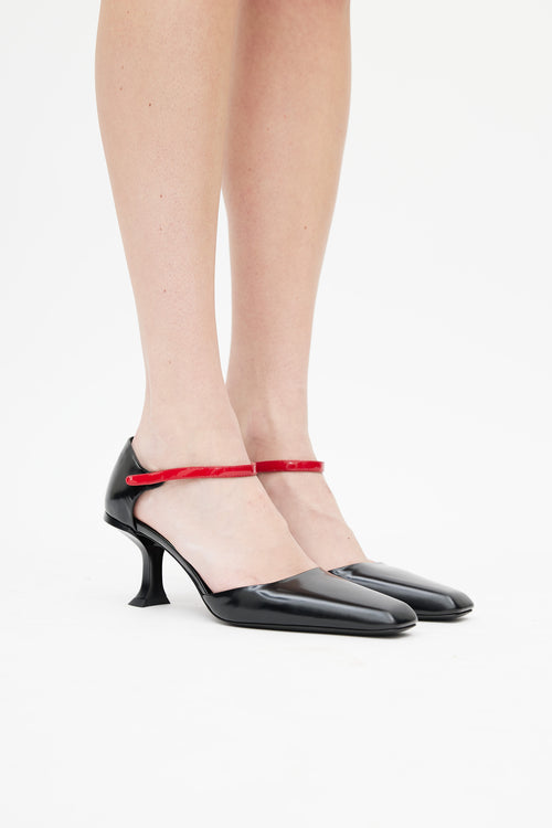 Prada Black 
Red Patent Pump