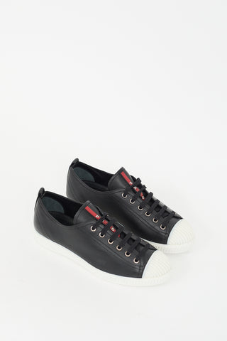 Prada Black 
White Leather Low Top Sneaker