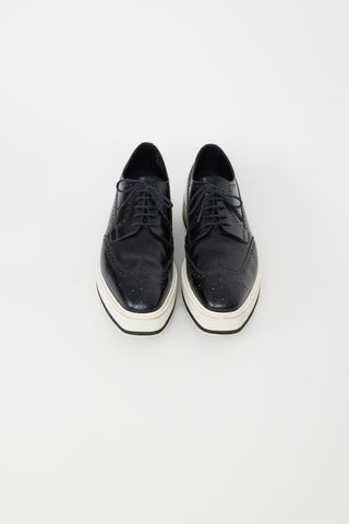 Prada Black 
White Leather Brogue Platform Oxford