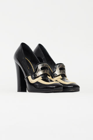 Prada Black 
Cream Patent Leather Pump