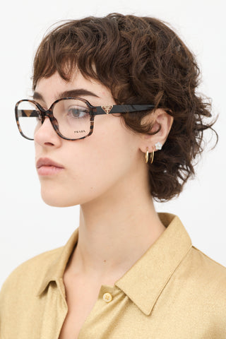 Prada Brown 
Clear VPR12N Round Glasses