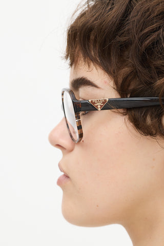 Prada Brown 
Clear VPR12N Round Glasses