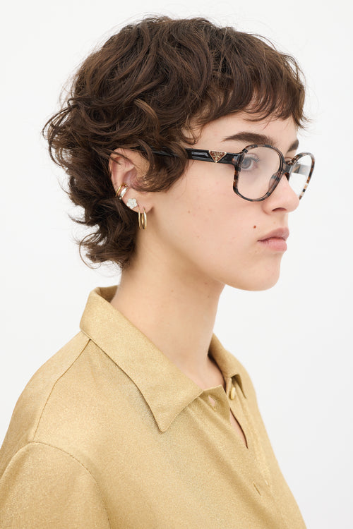 Prada Brown 
Clear VPR12N Round Glasses