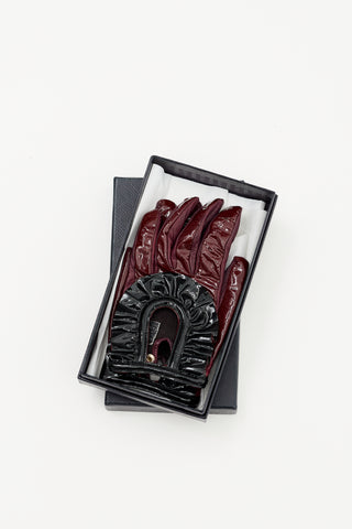 Prada Burgundy 
Black Patent Cut Out Gloves