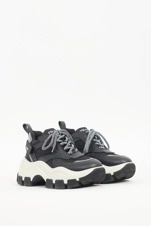 Prada Black 
White Leather Pegasus Sneaker