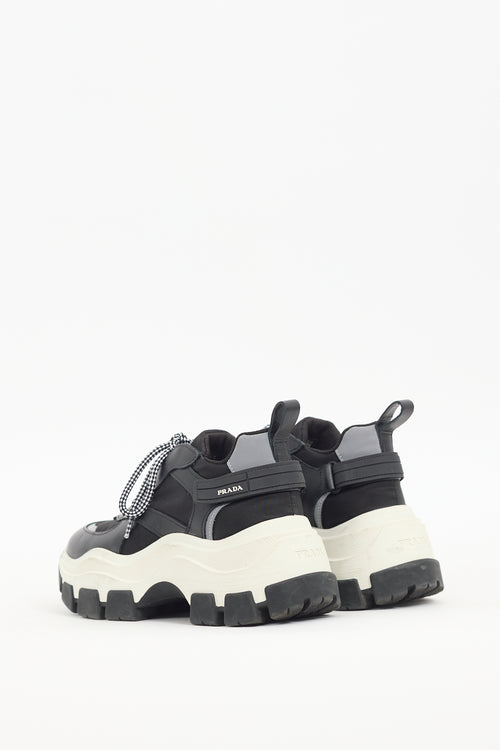 Prada Black 
White Leather Pegasus Sneaker