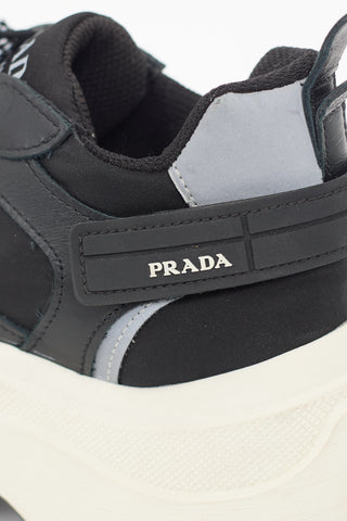 Prada Black 
White Leather Pegasus Sneaker