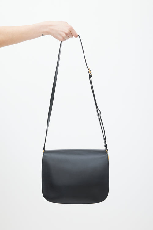 Saint Laurent Black 
Gold Leather Saddle Bag