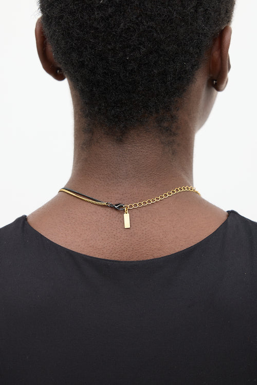 Saint Laurent Black 
Gold Layered Logo Necklace