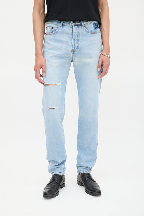 Saint Laurent Light Wash Distressed 
Embroidered Slim Jeans