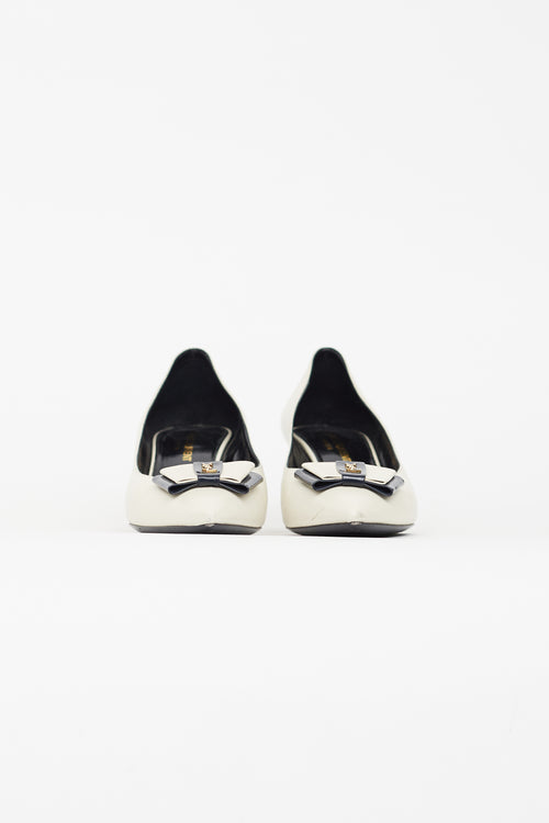 Saint Laurent Cream 
Black Pointed Toe Heel