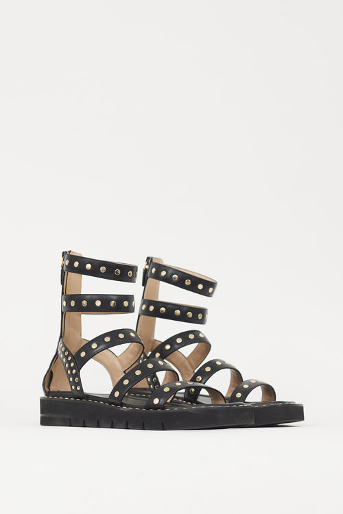 Stuart Weitzman Black 
Gold Studded Gala Lift Sandal