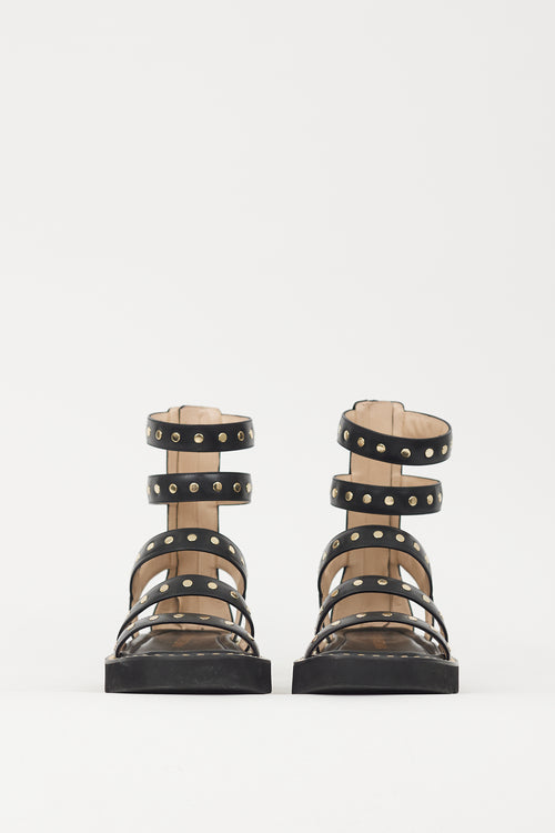 Stuart Weitzman Black 
Gold Studded Gala Lift Sandal