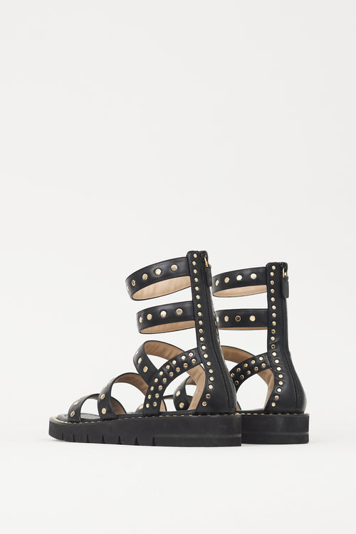 Stuart Weitzman Black 
Gold Studded Gala Lift Sandal