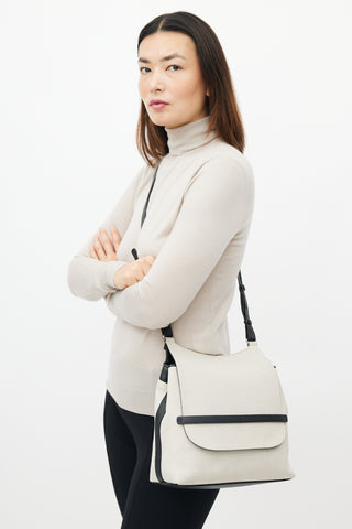 The Row Beige 
Black Canvas Sideby Bag