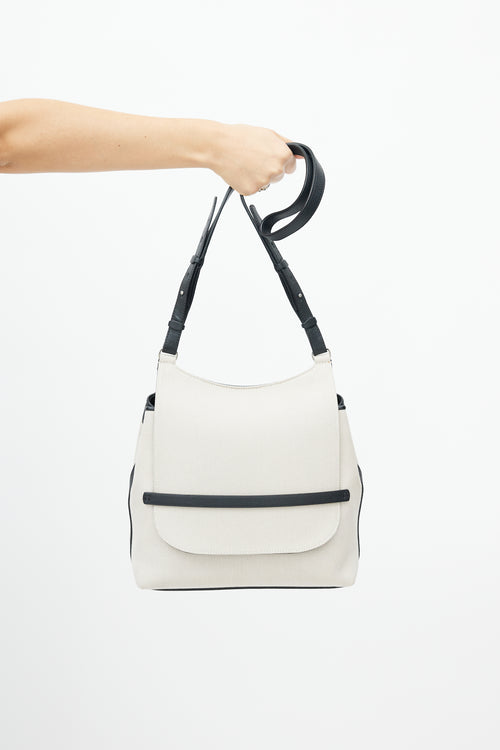 The Row Beige 
Black Canvas Sideby Bag