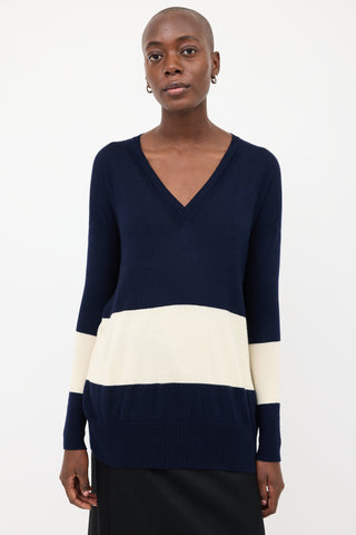 The Row Navy 
Cream V-Neck Sweater