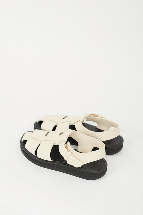 The Row Cream 
Black Leather Fisherman Sandal