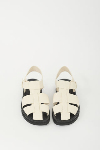 The Row Cream 
Black Leather Fisherman Sandal