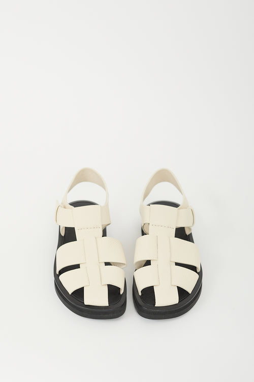 The Row Cream 
Black Leather Fisherman Sandal