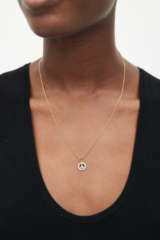 Tiffany 
Co. 18k Gold 
Diamond Peace Necklace