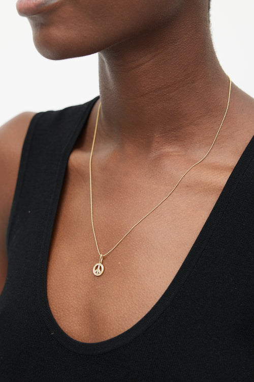 Tiffany 
Co. 18k Gold 
Diamond Peace Necklace