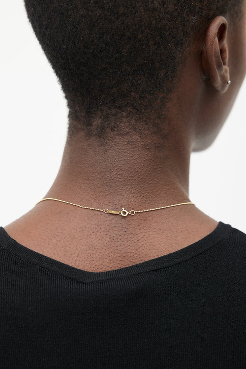 Tiffany 
Co. 18k Gold 
Diamond Peace Necklace