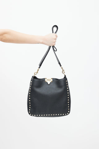 Valentino Black 
Gold Rockstud Flip Lock Leather Bag