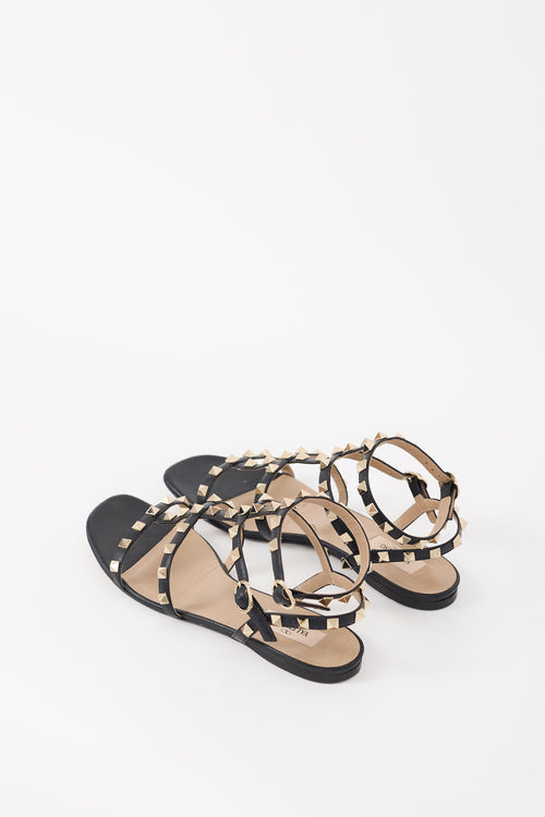 Valentino Black 
Gold Rockstud Caged Sandal