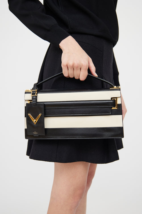 Valentino Black 
White Stripe My Rockstud Clutch